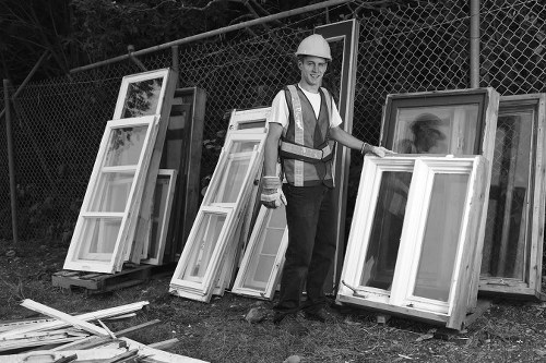 Hoarder clearance professionals organizing a cluttered room in Upminster