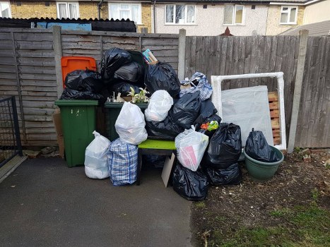 Professional hoarder clearance team working in a Brixton home