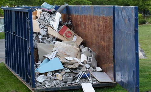 Professionals assisting with hoarder clearance in a residential home