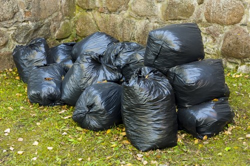 Professional waste clearance team removing builders waste