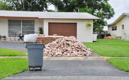 Hoarder clearance team safely removing items from a home