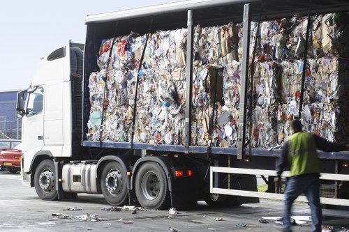 Hoarder clearance professionals working efficiently