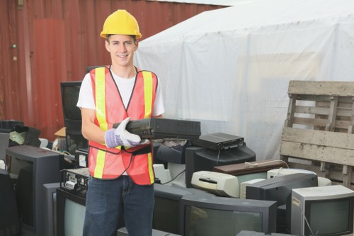 Hoarder clearance team removing items from a residence in North End