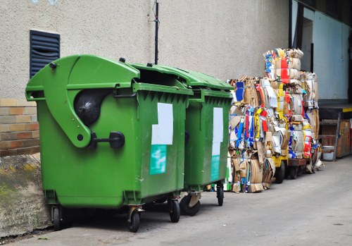 Experts responsibly disposing of items during hoarder clearance.