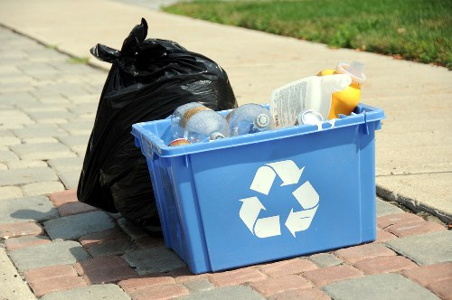 Cluttered living space being organized by experts