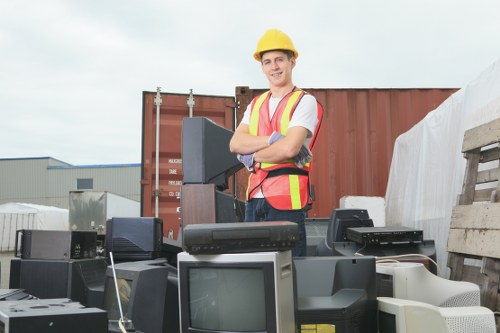 Cluttered living space being organized by clearance experts