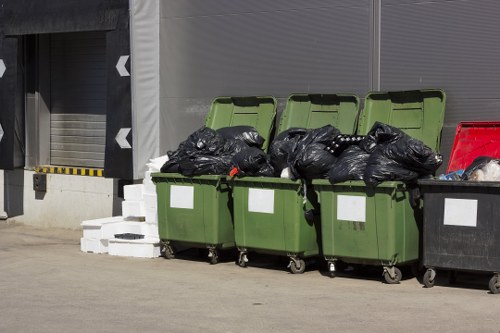 Professionals disposing of items responsibly during clearance