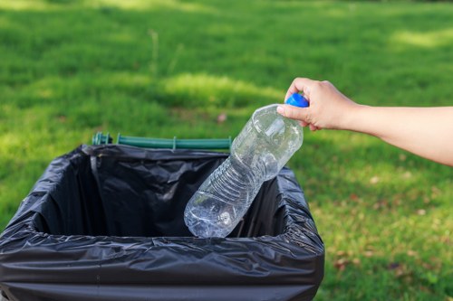 Professionals cleaning and sanitizing a cluttered space